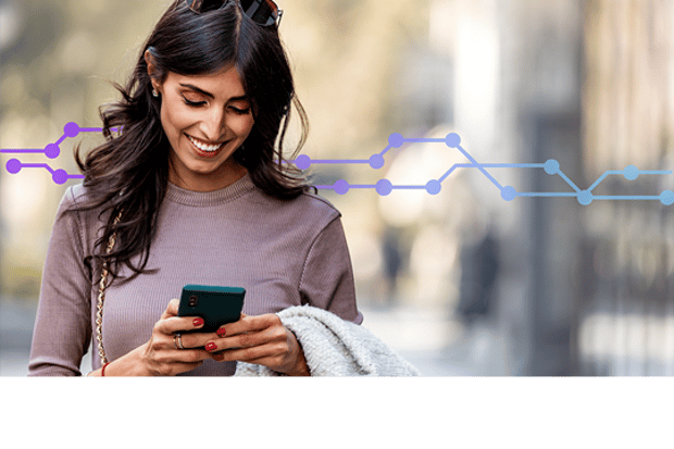 Smiling woman using a mobile phone